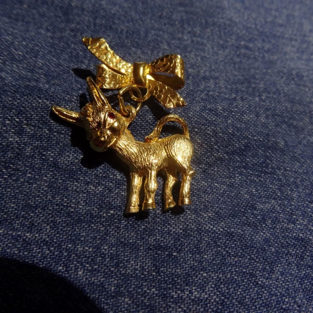 Vintage Goldtone Donkey Hanging From Bow Brooch